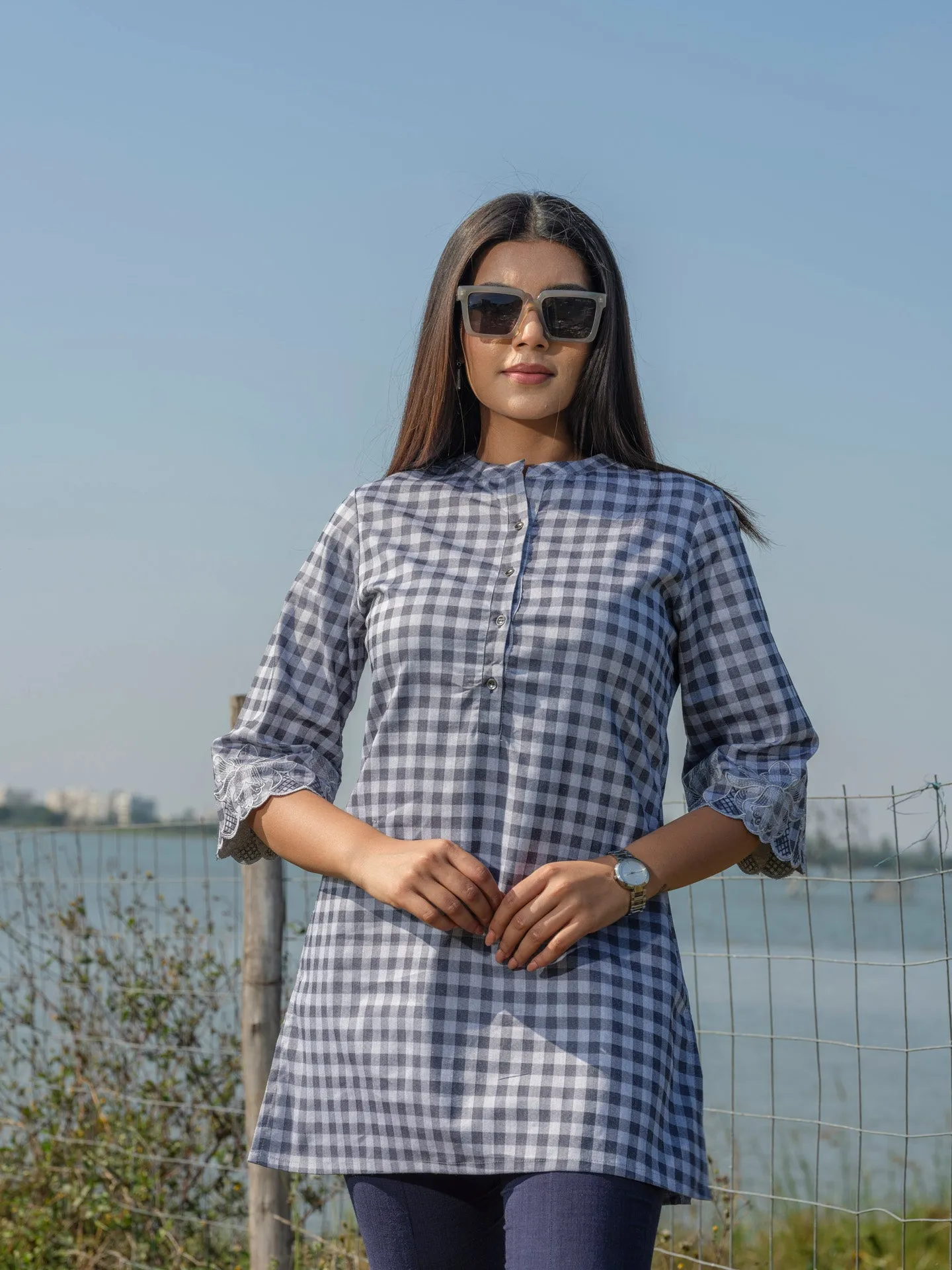 Cotton lycra checks top with cutwork embroidery at sleeves